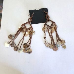 Brass dangle earrings with shell pieces
